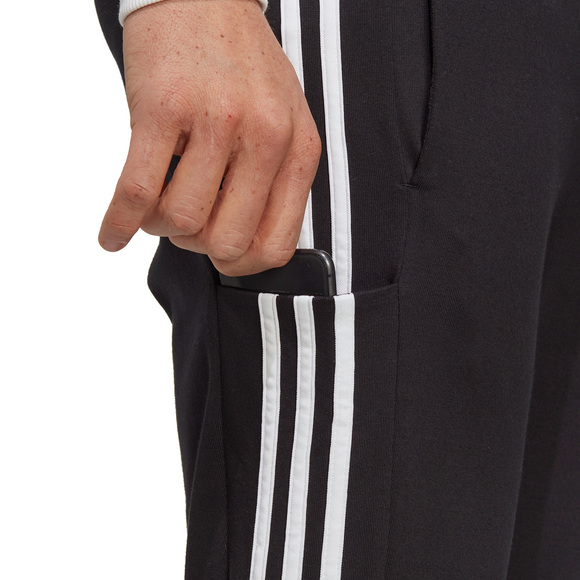 Spodnie męskie adidas Essentials Single Jersey Tapered Open Hem 3-Stripes czarne IC0044