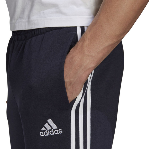 Spodnie męskie adidas Essentials Tapered Cuff 3 Stripes granatowe GK8888