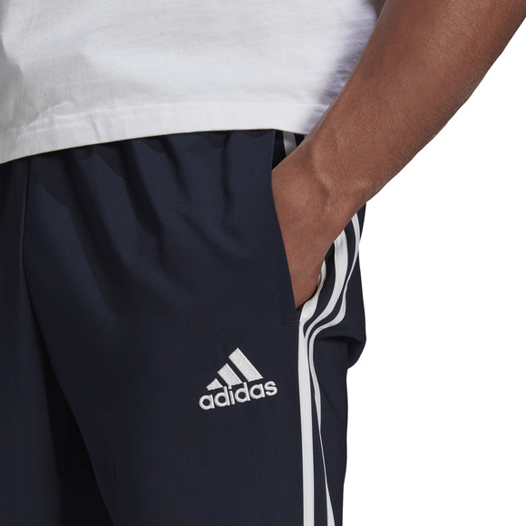 Spodnie męskie adidas Essentials Tapered Cuff 3 Stripes Pants granatowe GK8981 